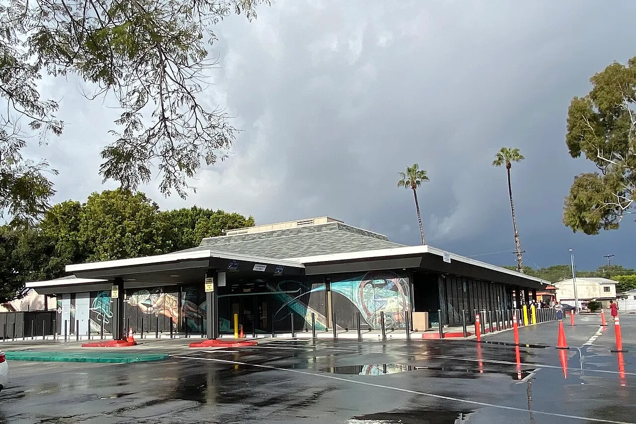 Exterior of the California DMV office in Culver City, with a wet parking lot after rain