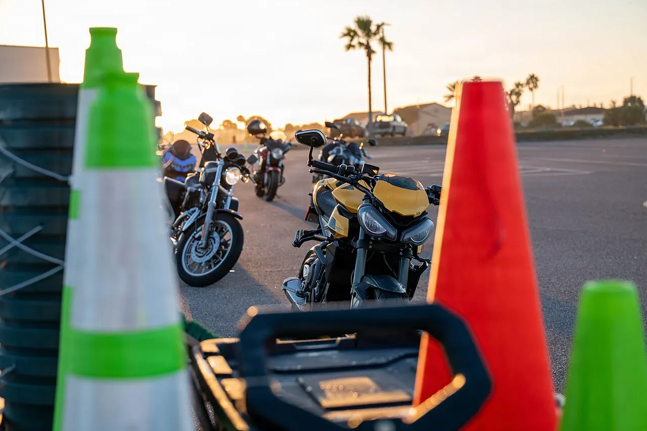 Motorcycles lined up on a practice range during a rider safety course at Patrick Space Force Base, Florida