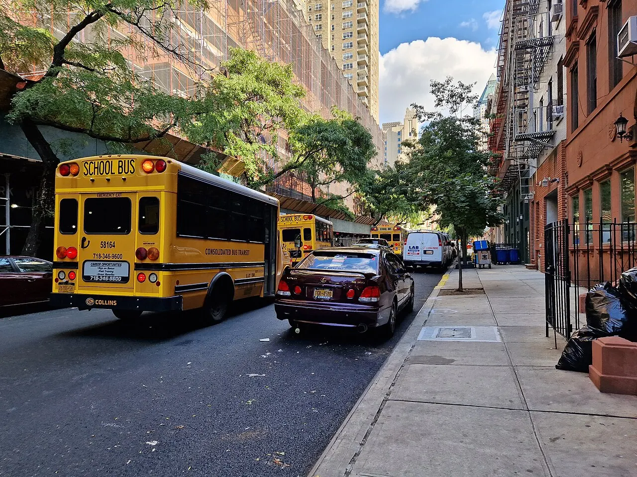 Yellow school buses on 50th Street in Manhattan, New York City