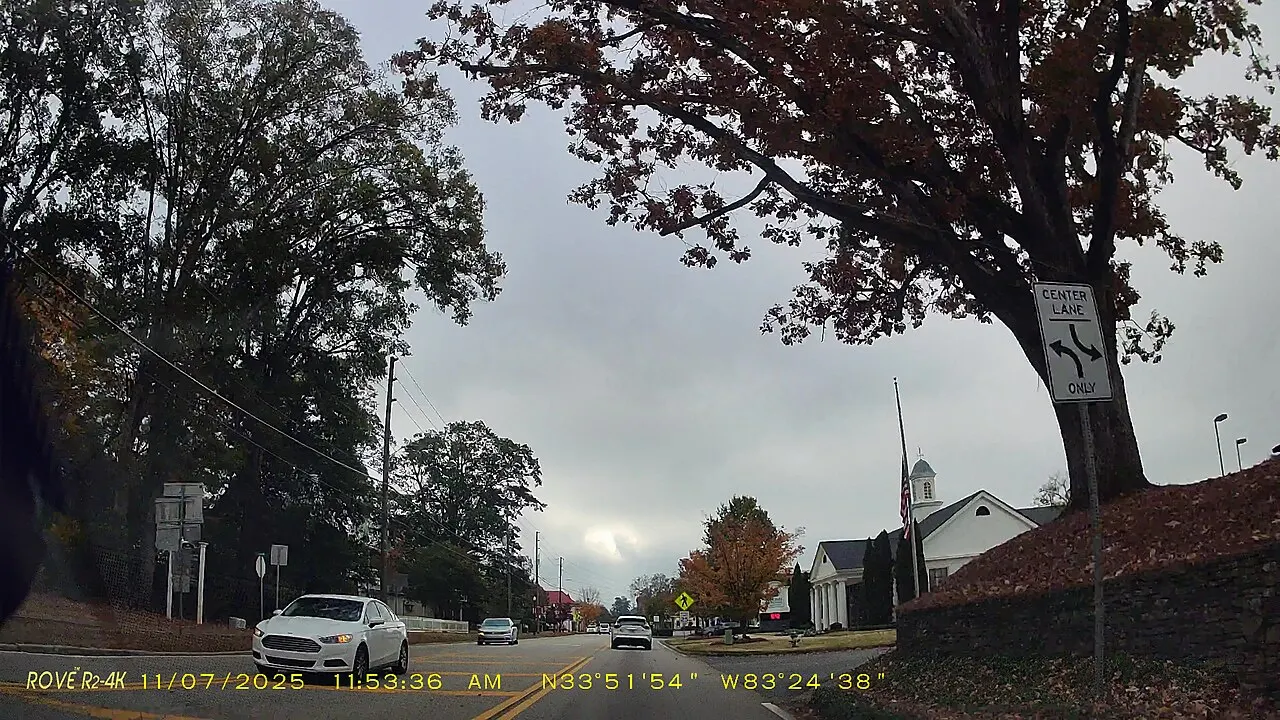 Center Lane Only sign with opposing left-turn arrows beside southbound Georgia State Route 15