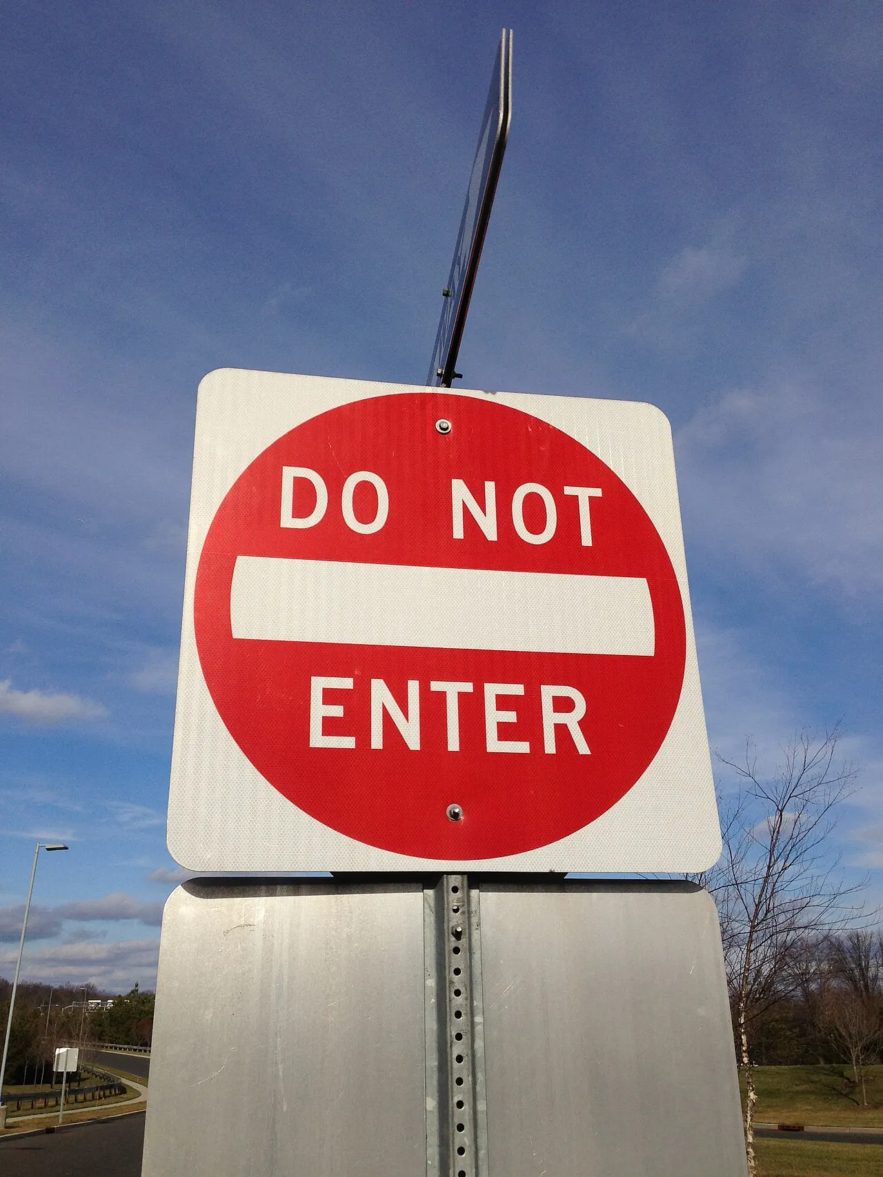 Do Not Enter sign, a red circle with a white bar on a white square, on a post in Ewing, New Jersey