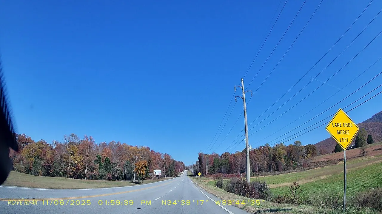 Lane Ends Merge Left warning sign beside northbound Georgia 75 in White County, seen from a car