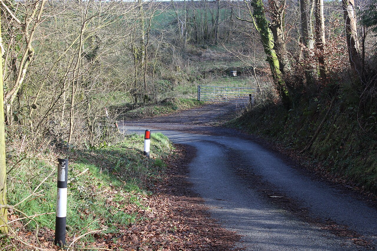 A bend on a UK country road, typical of rural test routes