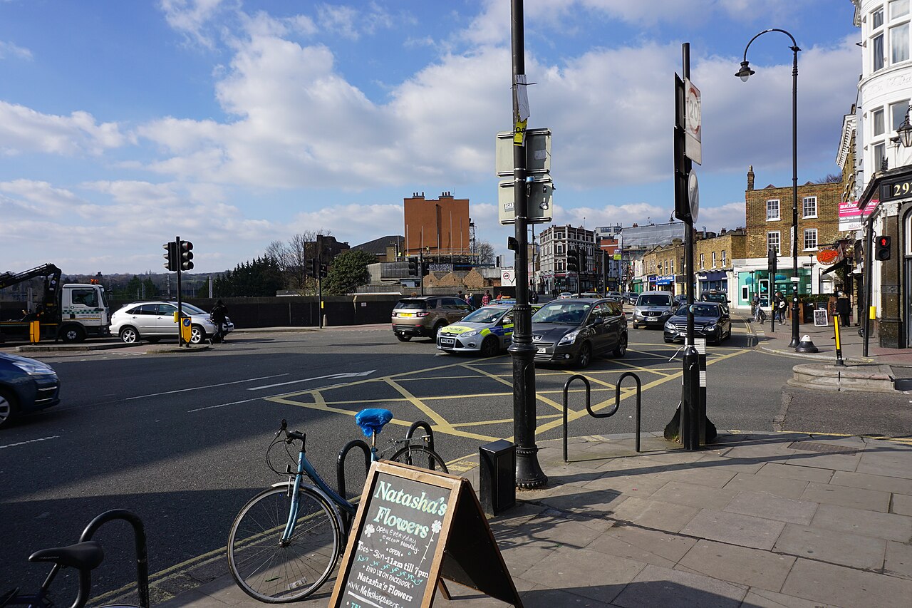 A busy urban junction, the dense city driving that private-hire work is built around