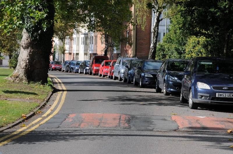 Cars parked along a UK residential street, the urban environment private-hire drivers work in