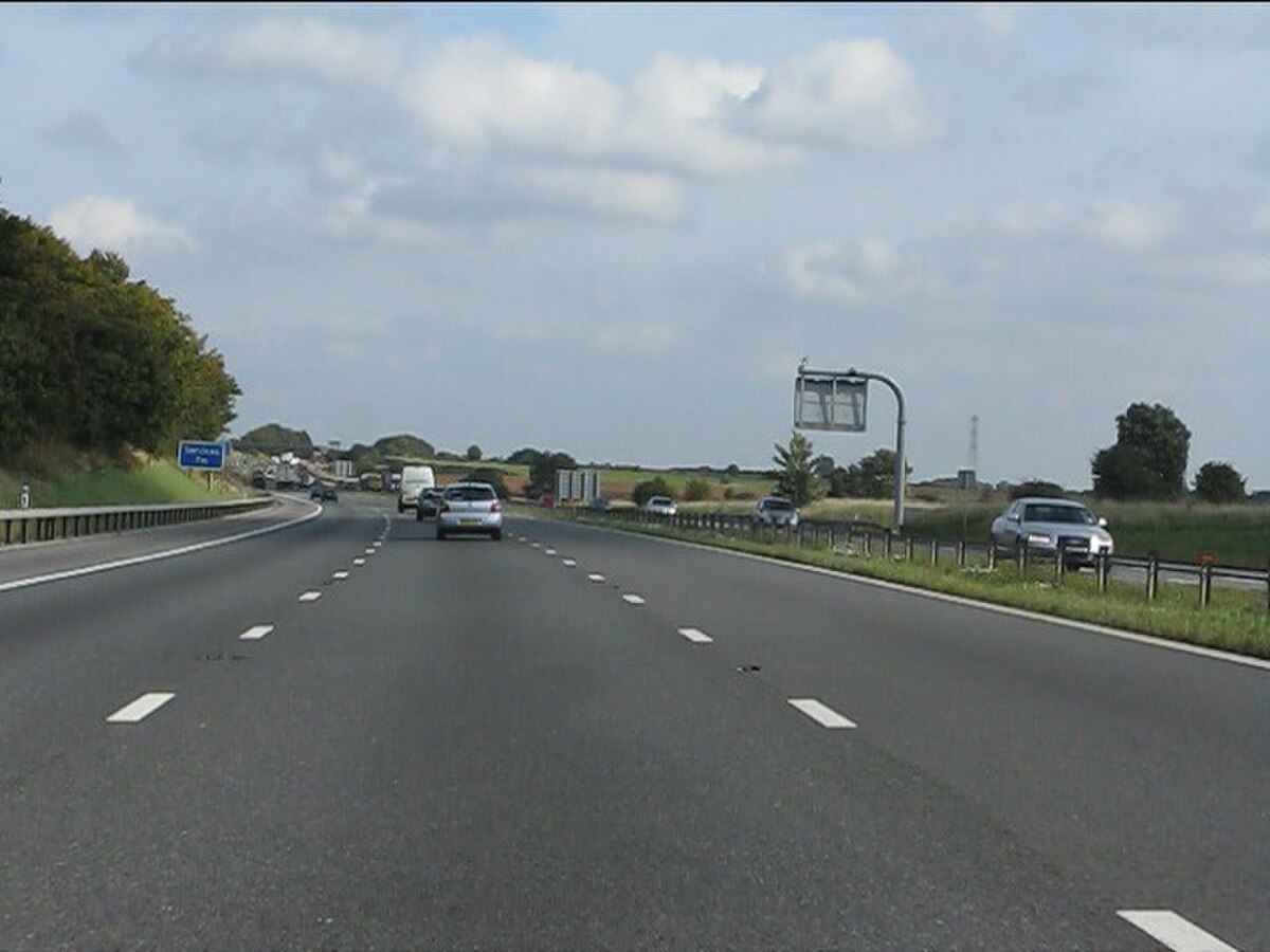 M4 motorway in open countryside -- the motorway module covers merging, lane discipline and high-speed gap management