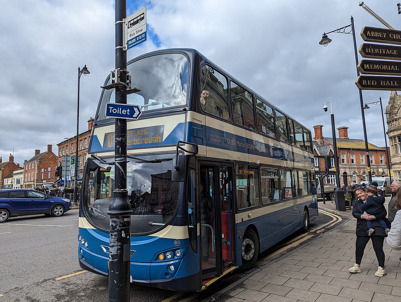A British bus pulled in at a UK bus stop