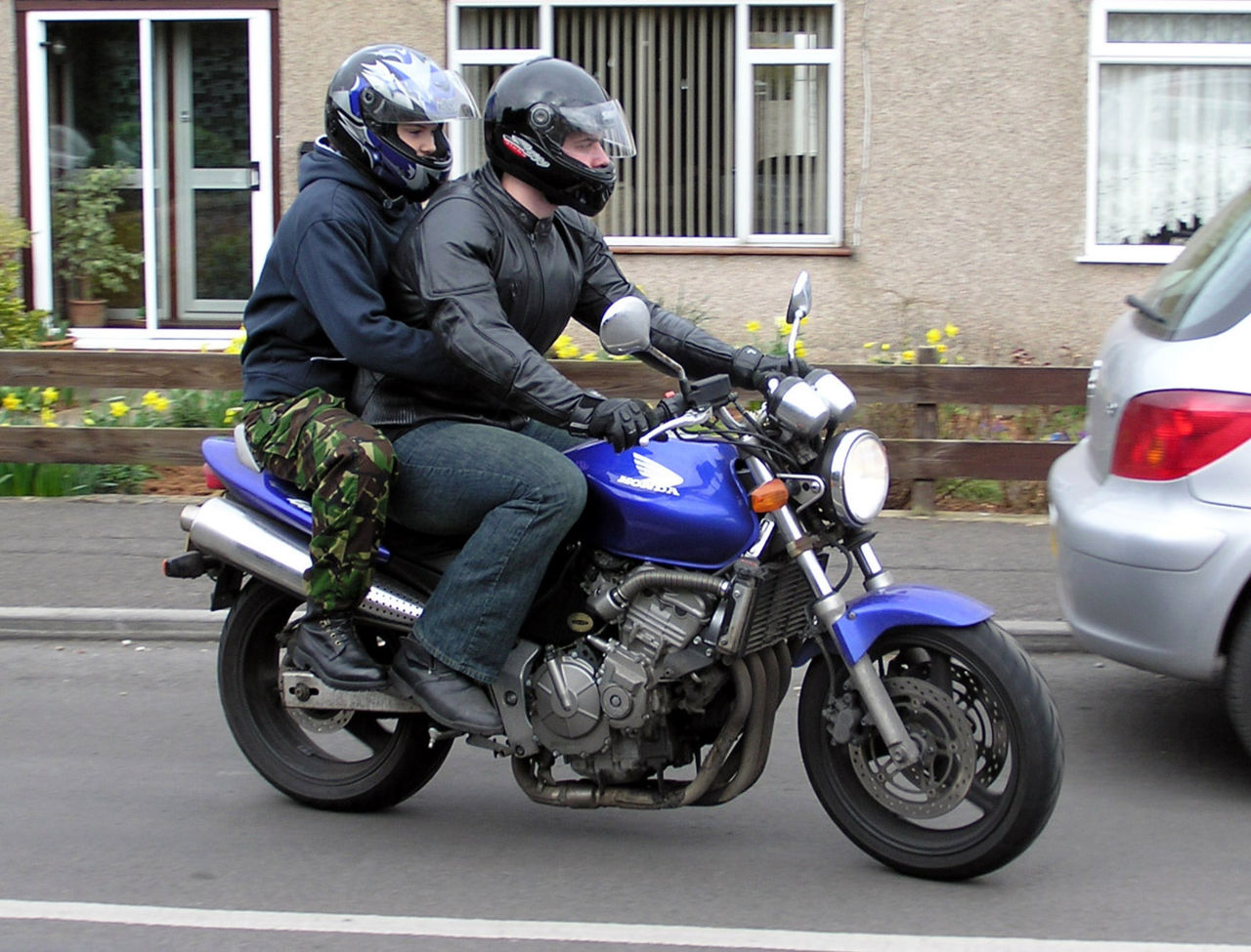 Motorcycle riders on a road, the on-road context for UK motorcycle test riding