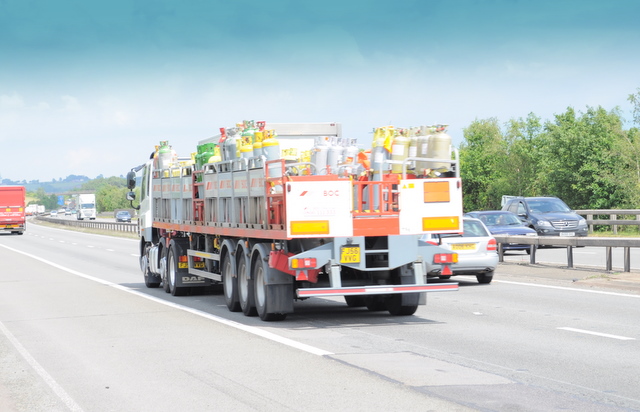 A rigid HGV carrying a load on a UK motorway