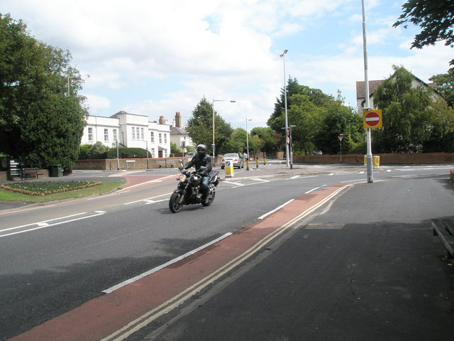 A motorcyclist at a UK road junction