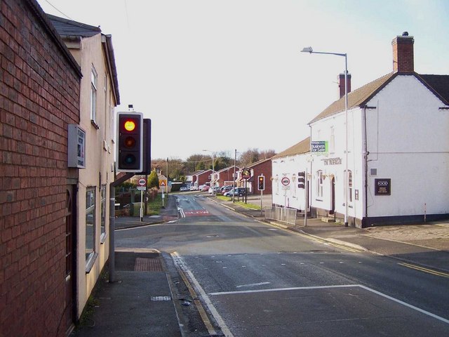 A red traffic light on a UK residential street
